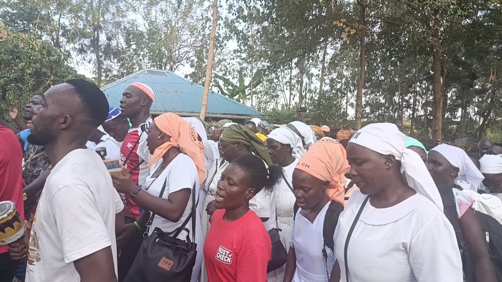 Manyatta Kisumu Diocese Youth members marching along outdoor pathway
